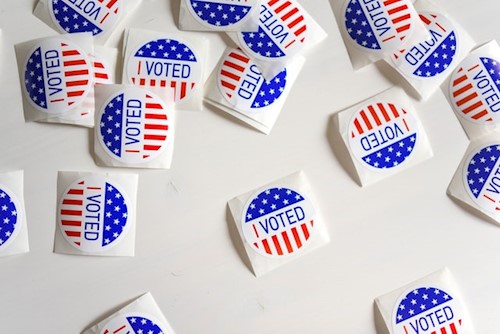 I voted stickers scattered on white background